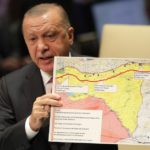 Turkey's President Recep Tayyip Erdogan holds up a map as he addresses the 74th session of the United Nations General Assembly at U.N. headquarters in New York City, New York, U.S.