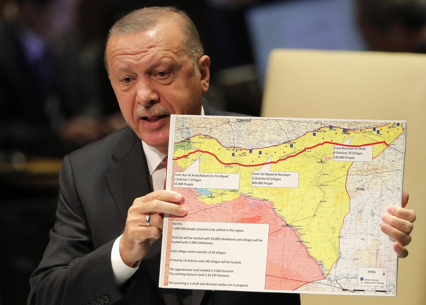 Turkey's President Recep Tayyip Erdogan holds up a map as he addresses the 74th session of the United Nations General Assembly at U.N. headquarters in New York City, New York, U.S.