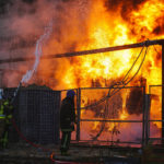 Firefighters work to put out a fire in a thermal power plant, damaged by a Russian missile strike in Kyiv