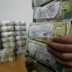 الليرة السورية واصلت تحسنها أمام الدولار الأميركي (أسوشيتد برس)
